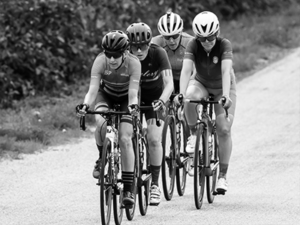 Group of 4 riders race together
