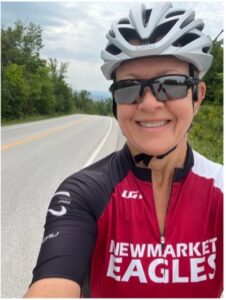 Nancy smiling in a selfie during a road cycle