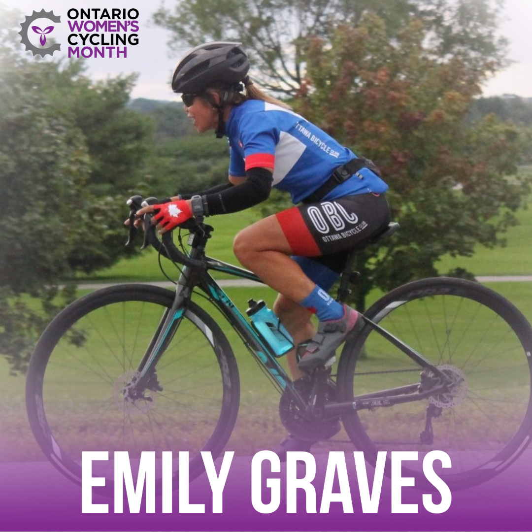 Female cyclist in blue and black Ottawa Bicycle Club Kit enjoying a ride