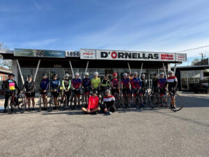 group of women cyclists outside d'ornellas bike shop