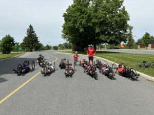 Group of Para cyclists smiling at the camera